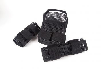 A set of three black mesh bags sitting on top of each other.