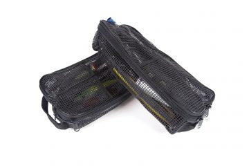 Two black bags sitting next to each other on a white surface.