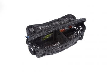 A black mesh bag with some items inside of it