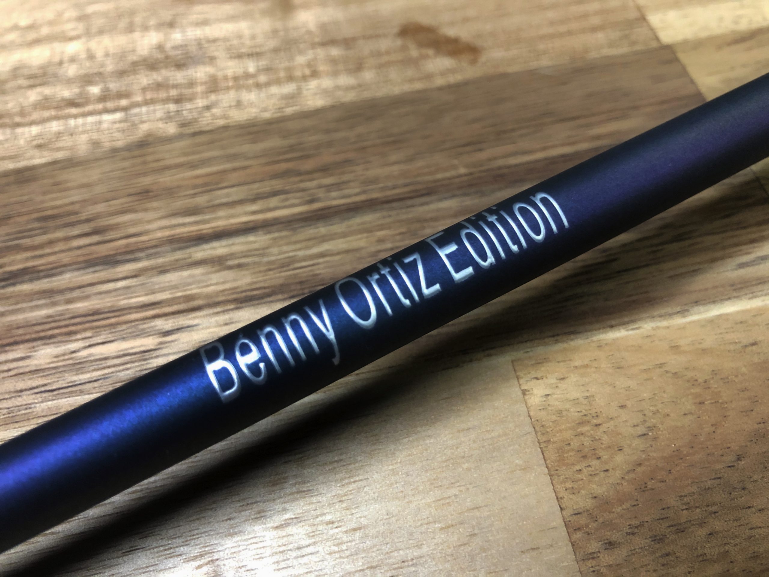 A close up of the bottom of a pen with the name benny ortiz edition written on it.