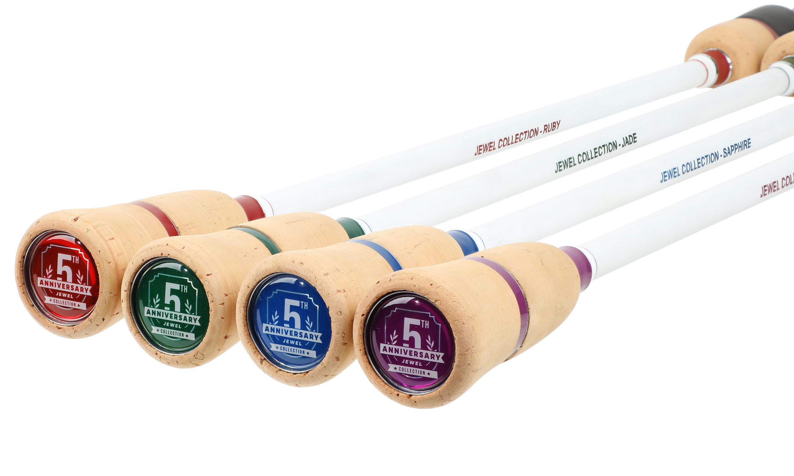 A group of four wooden poles with different colored tops.