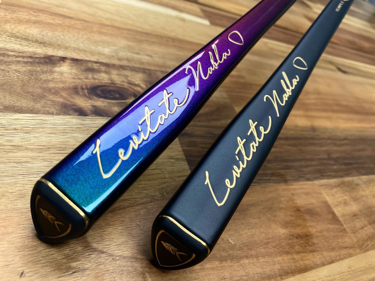 Two baseball bats with the name of " leonidas vallas ".